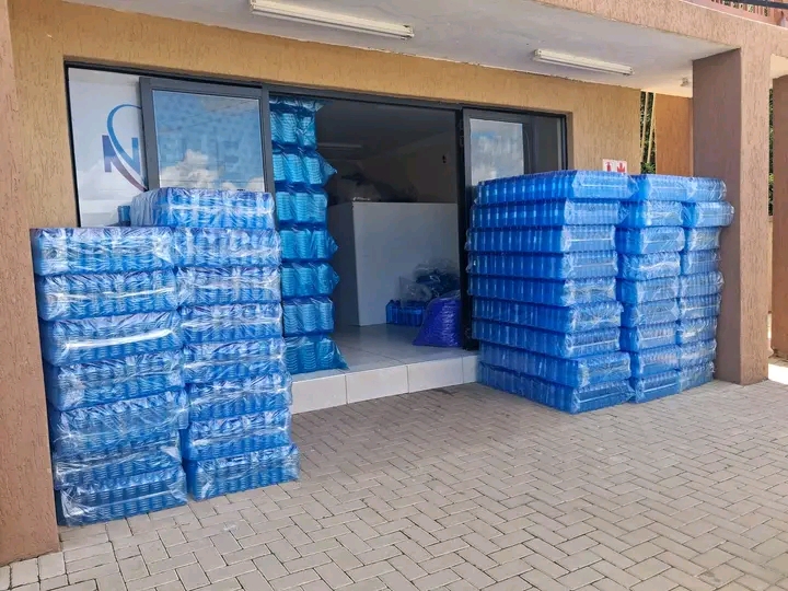 Pallets of shrink-wrapped PET bottles ready for dispatch at Book A Bottle facility